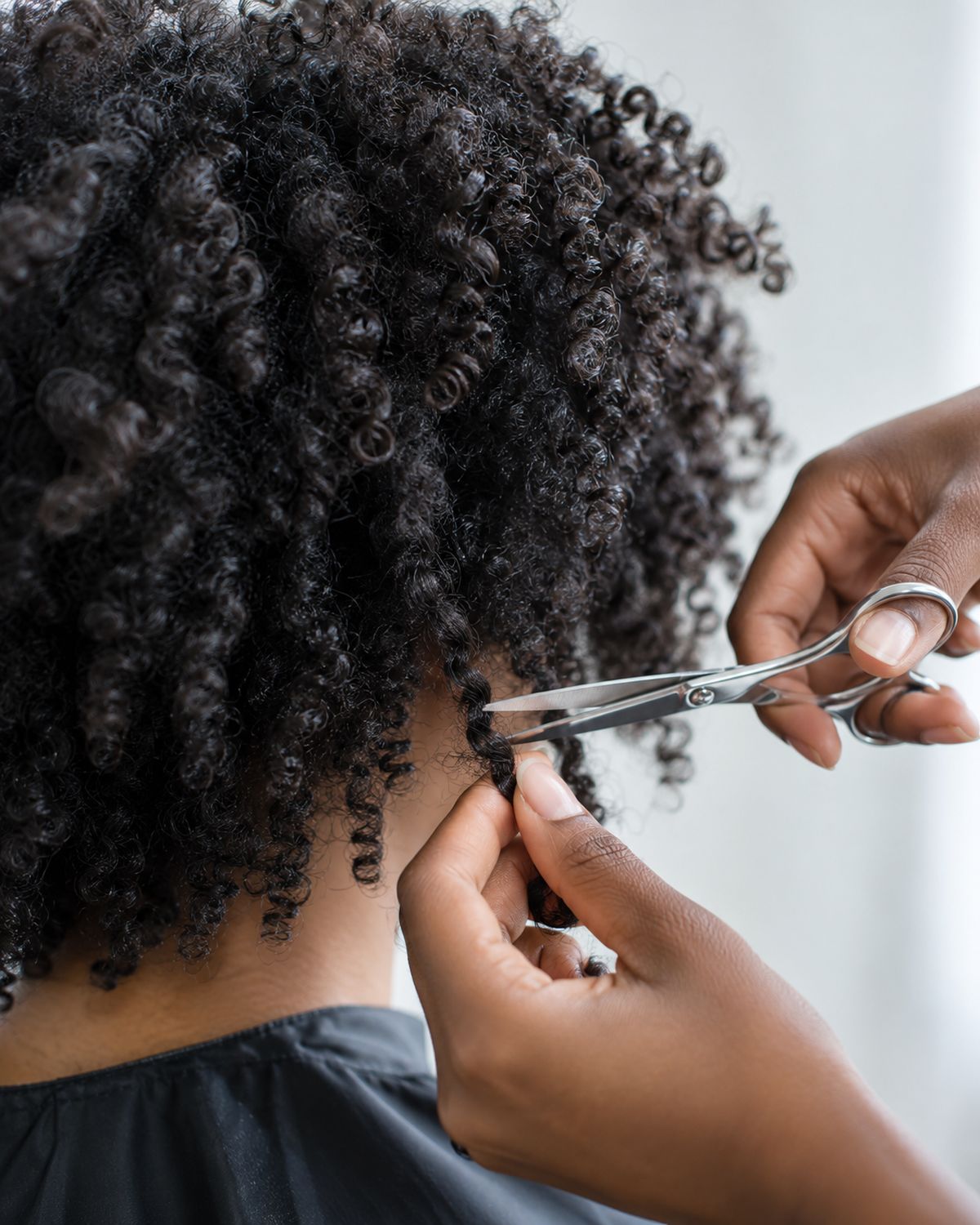 Scissors shaping defined coily curls